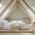 Photorealistic interior of a sunlit attic bedroom featuring a sloped ceiling, a queen-size platform bed with light linens, minimalist Scandinavian design elements, and natural textures, all captured in golden hour lighting.