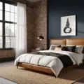 A sophisticated masculine bedroom featuring a dark walnut platform bed with a cognac leather headboard, deep navy accent wall, and crisp white linens, illuminated by golden hour light through floor-to-ceiling windows, with industrial pendant lights and minimalistic artwork.